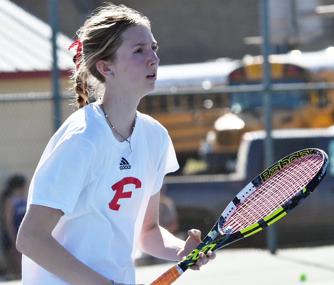 Ava Collins of the FHS tennis team gets set to receive a serve from the Mason Punchers last Thursday at the Battlin’ Billie Tennis Invitational.—Standard-Radio Post/Cary Burgess