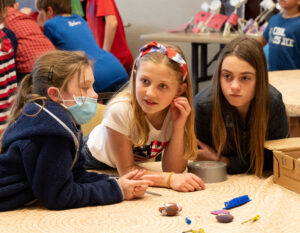 Fifth grade students from St. Mary’s Catholic Church participated in pop-up shops at the Holy Family Center to sell three-dimensional items they had created using a 3-D printer in their Challenge Lab class. Money from the students’ sales went toward the St. Mary’s Catholic School band program. Pictured, from left, are Avery Gardner, Charlotte Kordzik and Arianna Hudson. 