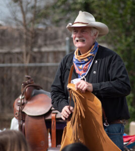 Lindy Segall presented about cowboy life and special cowboy gear to the students at the outdoor cooking event. Friday’s program was a culmination of studies focused on cattle drives and the history of Texas by Principles of Hospitality teacher Justin Elliott. – Standard-Radio Post/Brent Burgess